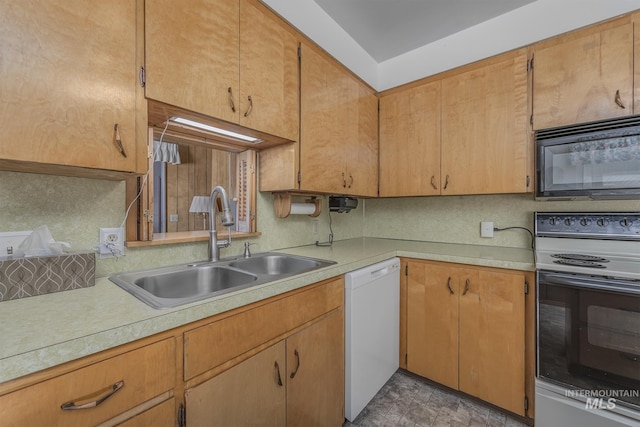 1040 N Pennsylvania Ave, Fruitland, ID 83619 - kitchen with black microwave, electric range, dishwasher, a sink, and light countertops