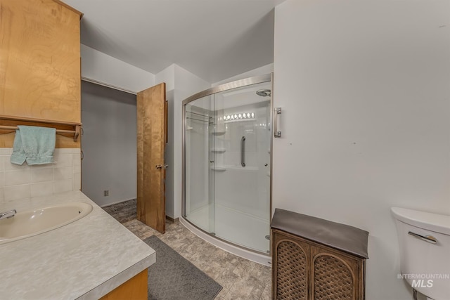 1040 N Pennsylvania Ave, Fruitland, ID 83619 - full bathroom with a shower stall, vanity, and backsplash