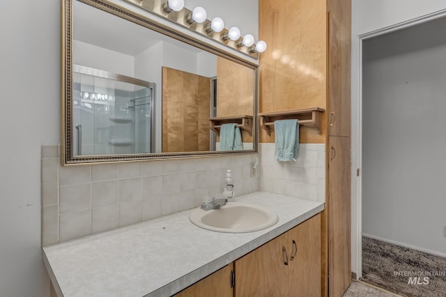 1040 N Pennsylvania Ave, Fruitland, ID 83619 - bathroom with vanity, decorative backsplash, and a shower stall