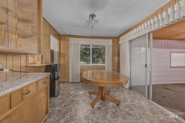 1040 N Pennsylvania Ave, Fruitland, ID 83619 - dining area with wooden walls and a textured ceiling