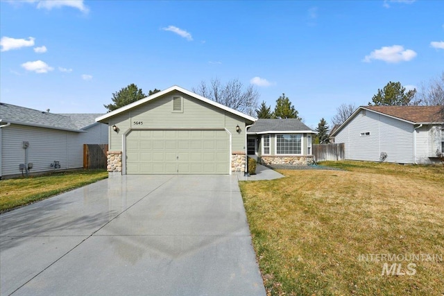 single story home featuring driveway, a front lawn, stone siding, fence, and a garage