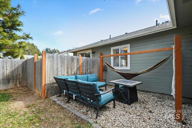 exterior space featuring fence and an outdoor fire pit