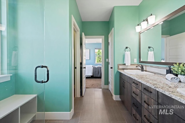 3671 S Pheasant Tail Way, Boise, ID 83716 - ensuite bathroom with baseboards, double vanity, and a shower stall