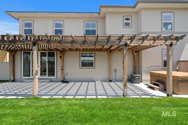 3671 S Pheasant Tail Way, Boise, ID 83716 - rear view of house with a hot tub, stucco siding, a patio, and a pergola