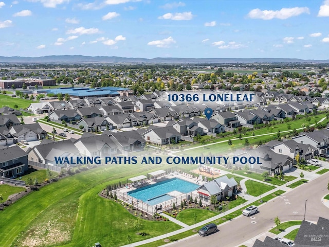 10366 Loneleaf Dr, Nampa, ID 83687 - aerial view of residential area featuring a pool area and mountains
