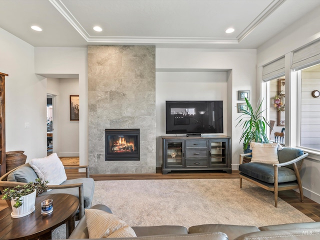 10366 Loneleaf Dr, Nampa, ID 83687 - living area with wood finished floors, a fireplace, ornamental molding, recessed lighting, and a raised ceiling