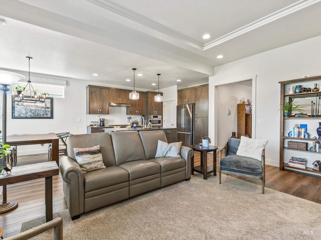 10366 Loneleaf Dr, Nampa, ID 83687 - living area with recessed lighting, wood finished floors, crown molding, a chandelier, and baseboards