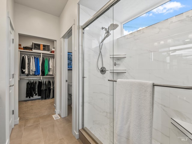 10366 Loneleaf Dr, Nampa, ID 83687 - bathroom featuring a shower stall, toilet, and a walk in closet
