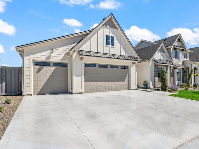 10366 Loneleaf Dr, Nampa, ID 83687 - modern farmhouse with concrete driveway, board and batten siding, a standing seam roof, an attached garage, and metal roof
