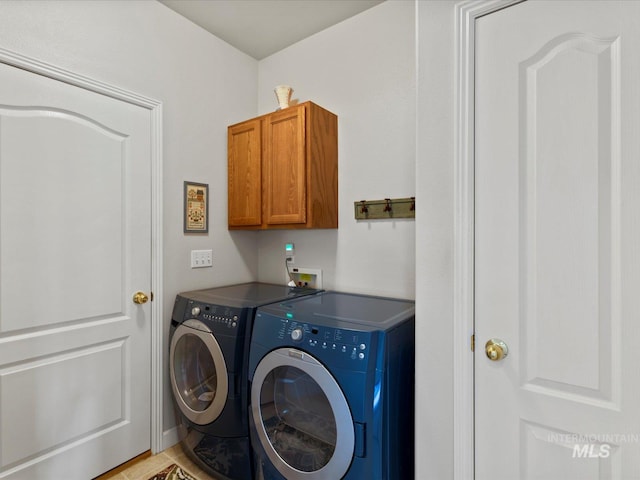 3369 W Monessen Ln, Meridian, ID 83646 - laundry room featuring washing machine and clothes dryer and cabinet space