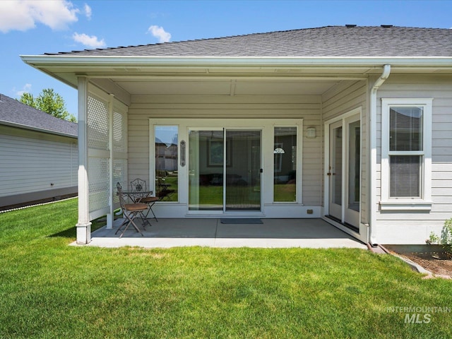 3369 W Monessen Ln, Meridian, ID 83646 - rear view of house featuring a patio, a lawn, and roof with shingles