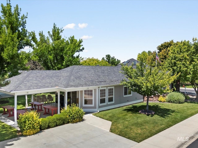 3369 W Monessen Ln, Meridian, ID 83646 - view of front of house featuring a front lawn and roof with shingles