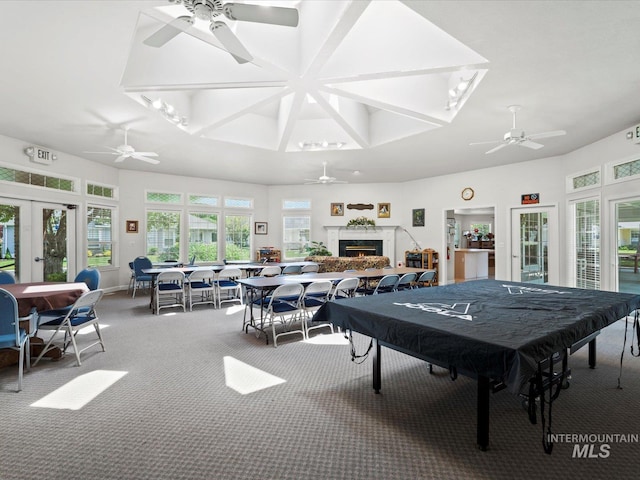 3369 W Monessen Ln, Meridian, ID 83646 - rec room with ceiling fan, carpet flooring, french doors, and a lit fireplace