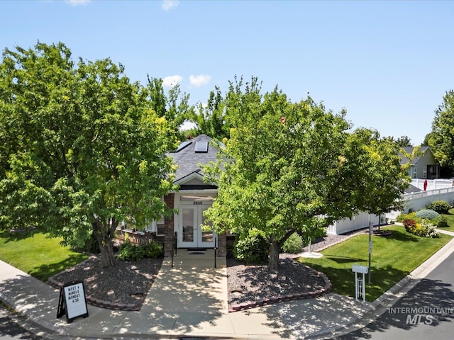 3369 W Monessen Ln, Meridian, ID 83646 - view of property hidden behind natural elements featuring french doors, a front lawn, and roof with shingles