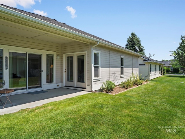 3369 W Monessen Ln, Meridian, ID 83646 - back of property with a yard and a patio area