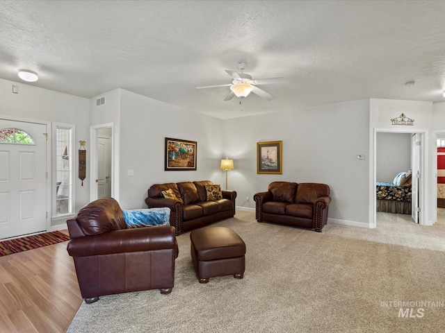 3369 W Monessen Ln, Meridian, ID 83646 - living room with a textured ceiling, ceiling fan, and carpet