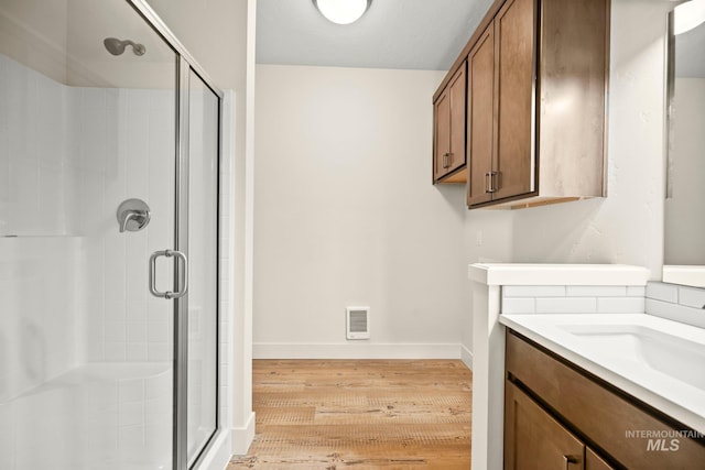 202 Broken Pne, Mccall, ID 83638 - bathroom with wood finished floors, a shower stall, and baseboards