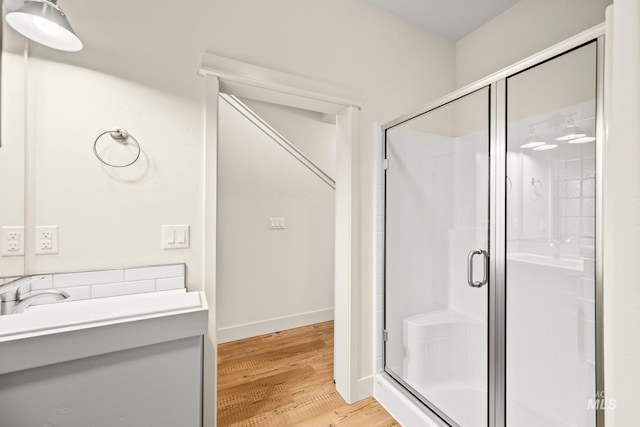 202 Broken Pne, Mccall, ID 83638 - bathroom with a stall shower, wood finished floors, and baseboards