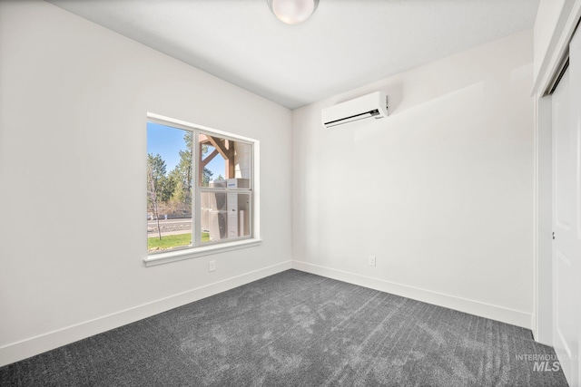 202 Broken Pne, Mccall, ID 83638 - unfurnished room featuring a wall mounted AC, dark colored carpet, and baseboards