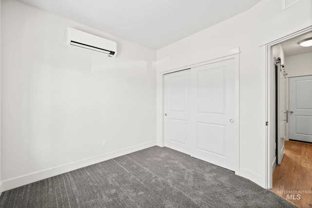 202 Broken Pne, Mccall, ID 83638 - unfurnished bedroom with a wall unit AC, a closet, carpet flooring, and baseboards