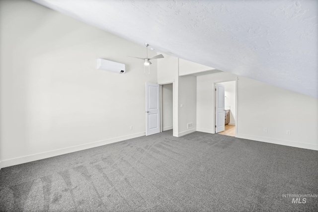 202 Broken Pne, Mccall, ID 83638 - additional living space with a wall mounted AC, carpet flooring, baseboards, a textured ceiling, and ceiling fan