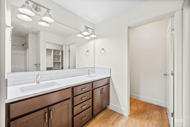 202 Broken Pne, Mccall, ID 83638 - full bath with tasteful backsplash, wood finished floors, double vanity, and baseboards
