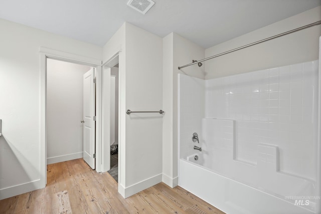 202 Broken Pne, Mccall, ID 83638 - bathroom with wood finished floors, baseboards, and  shower combination