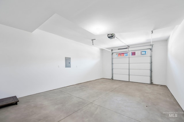 202 Broken Pne, Mccall, ID 83638 - garage featuring electric panel and a garage door opener