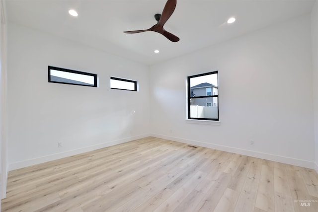 unfurnished room featuring ceiling fan and light wood-type flooring