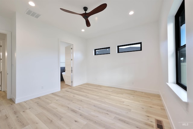 spare room with light hardwood / wood-style floors and ceiling fan