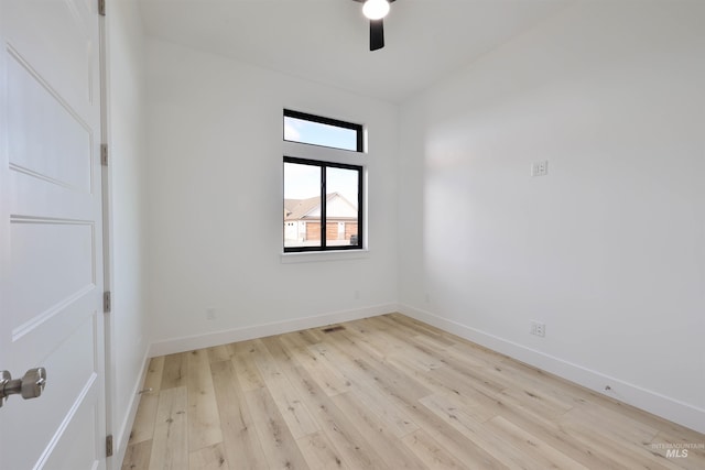 unfurnished room with light wood-type flooring and ceiling fan