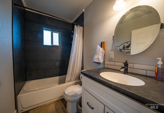 full bathroom featuring shower / tub combo, vanity, a textured ceiling, and toilet