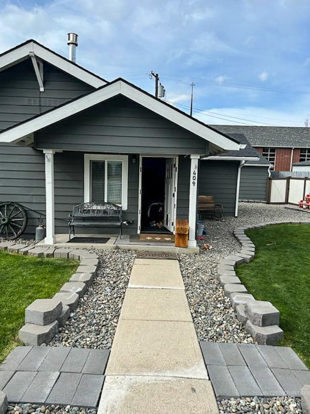 view of front of house featuring a front yard and a porch