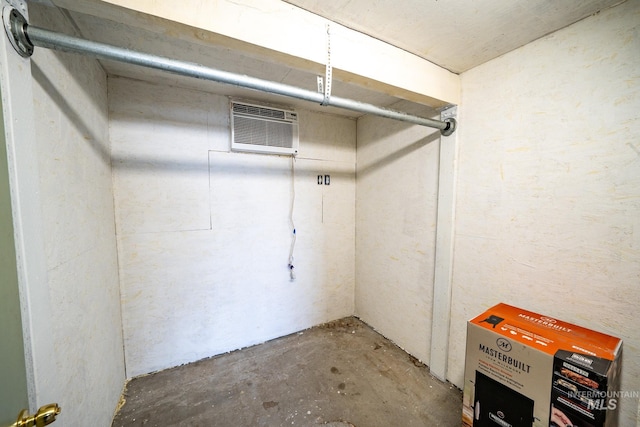 basement featuring a wall mounted air conditioner