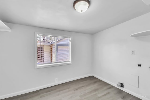 357 Filer Ave, Twin Falls, ID 83301 - laundry area with baseboards and wood finished floors