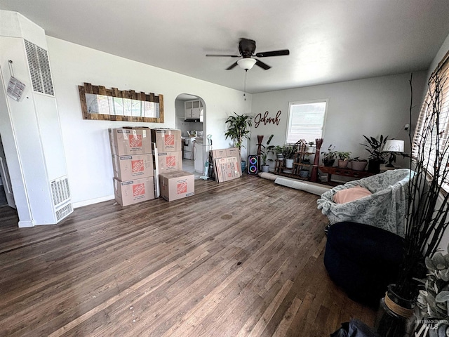 357 Filer Ave, Twin Falls, ID 83301 - living area with a heating unit, wood finished floors, a ceiling fan, and arched walkways