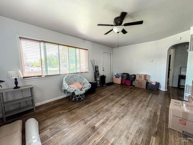 357 Filer Ave, Twin Falls, ID 83301 - living area with arched walkways, ceiling fan, wood-type flooring, and baseboards