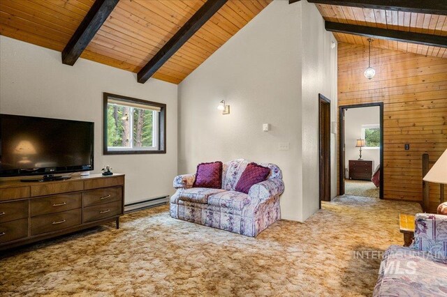 108 Panorama Dr, Cascade, ID 83611 - carpeted living area featuring wood ceiling with exposed beams, healthy amount of natural light, a baseboard radiator, high vaulted ceiling, and wood walls