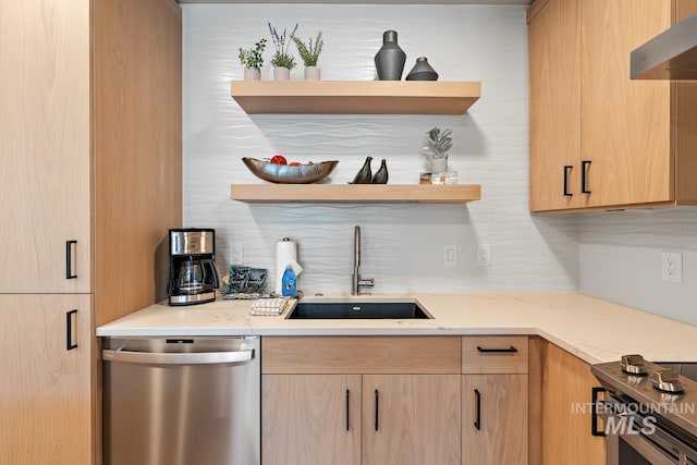 kitchen featuring sink, light stone countertops, decorative backsplash, stainless steel dishwasher, and light brown cabinets