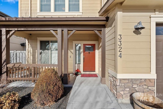 doorway to property featuring covered porch