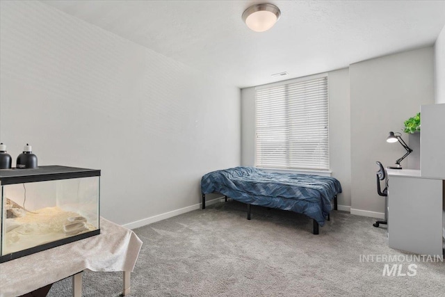 bedroom featuring light colored carpet