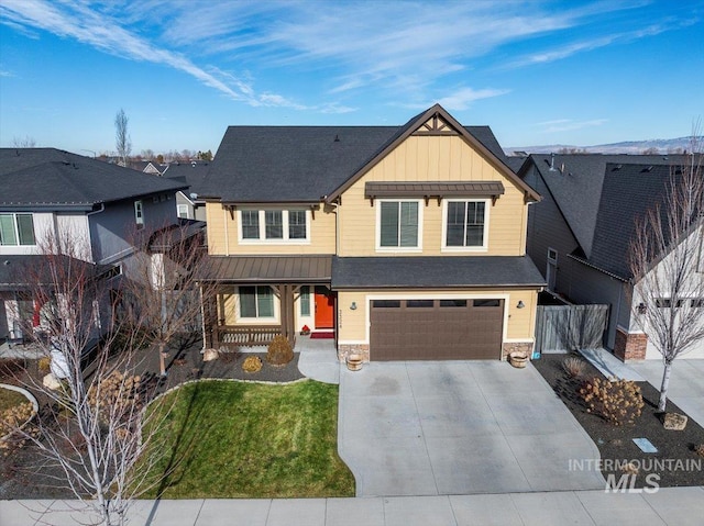 view of front of property featuring a garage and a front yard