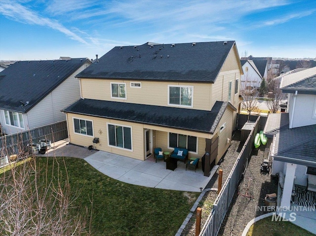 rear view of property with an outdoor hangout area, a patio area, and a yard