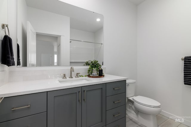 1950 W Gelding Ct, Middleton, ID 83644 - bathroom featuring vanity, toilet, tasteful backsplash, tile patterned floors, and a shower