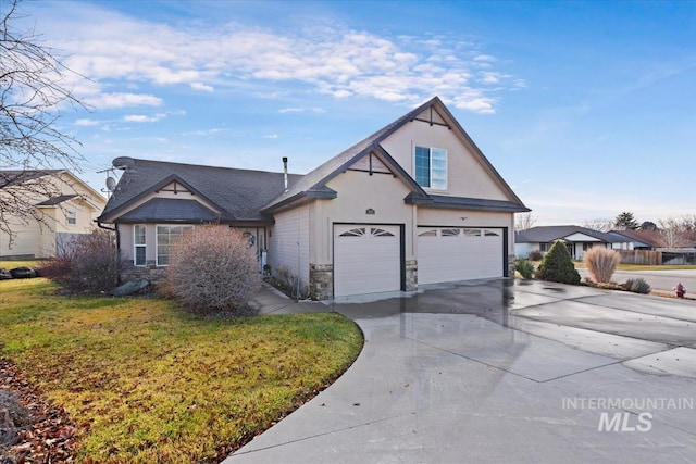 view of front of property with a front yard and a garage