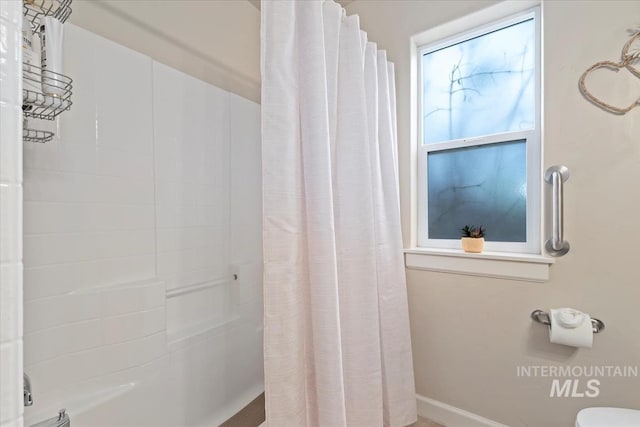 bathroom with a shower with curtain