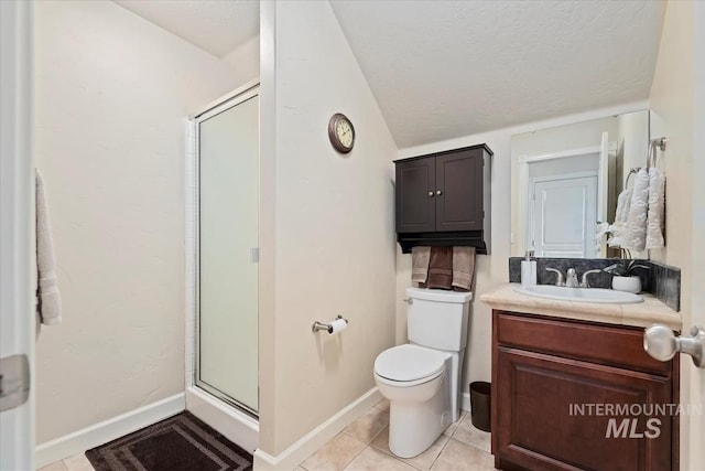 bathroom featuring tile patterned flooring, lofted ceiling, toilet, a shower with door, and vanity