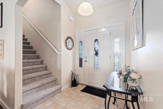 entrance foyer with light tile patterned floors