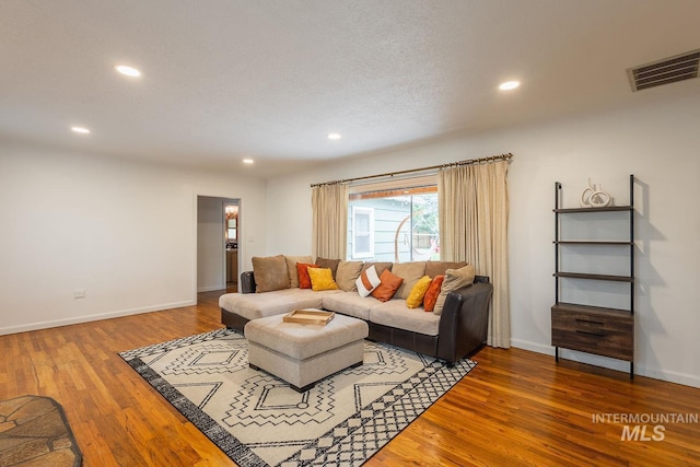 3102 N Sycamore Dr, Boise, ID 83703 - living area featuring wood finished floors, recessed lighting, and baseboards
