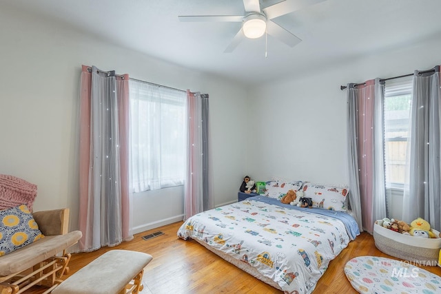 3102 N Sycamore Dr, Boise, ID 83703 - bedroom featuring wood finished floors, baseboards, and a ceiling fan
